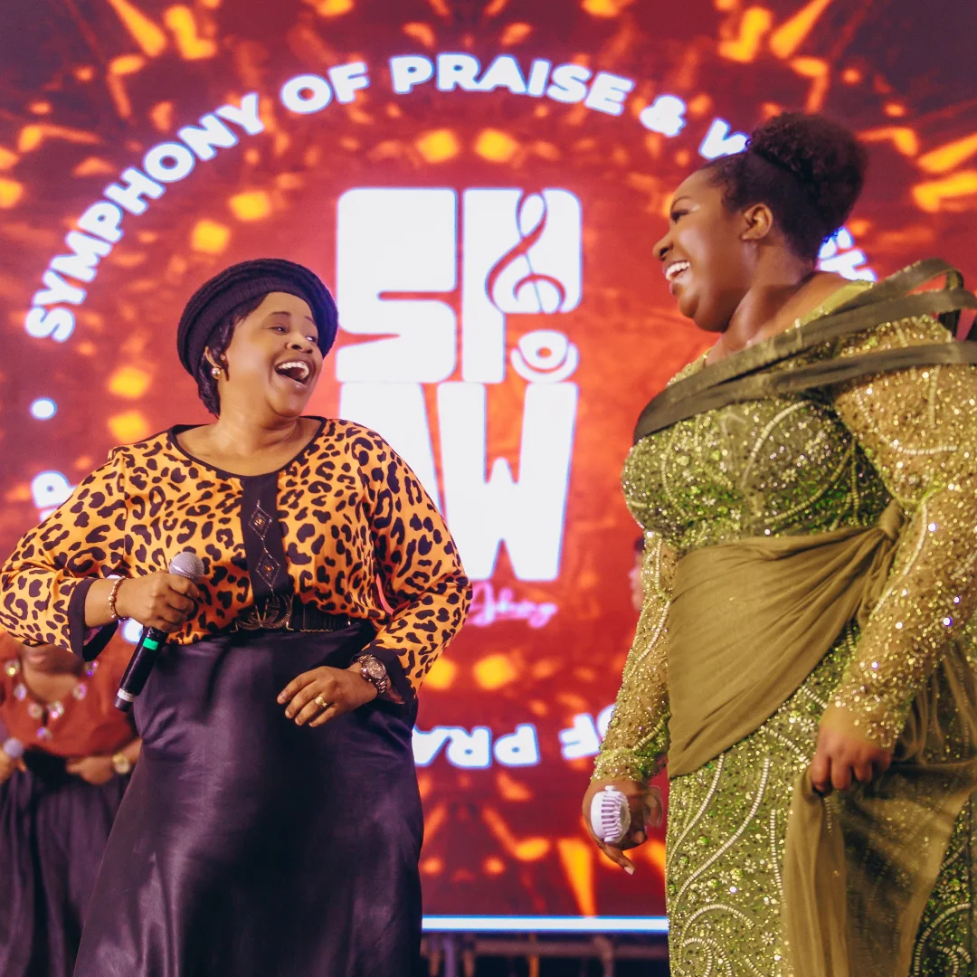 Two singers laughing together on the SPAW stage